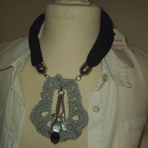 Hand crocheted necklace charm on black choker